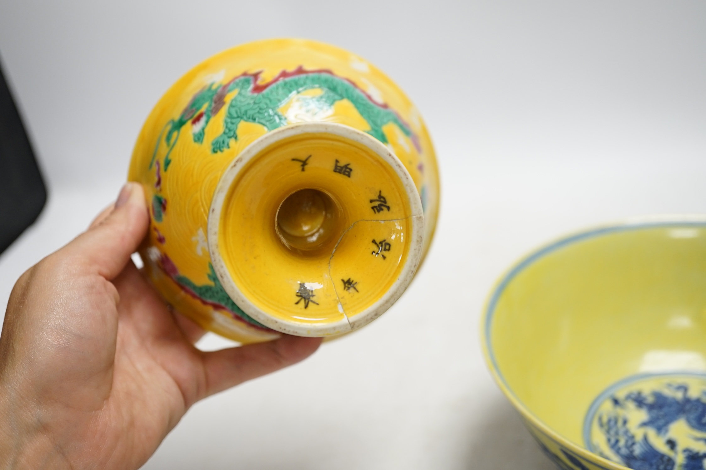 A Chinese yellow ground underglaze blue 'dragon' bowl, boxed, a yellow and green 'dragon' dish and a similar stem cup, yellow bowl 19.5cm diameter. Condition - good
